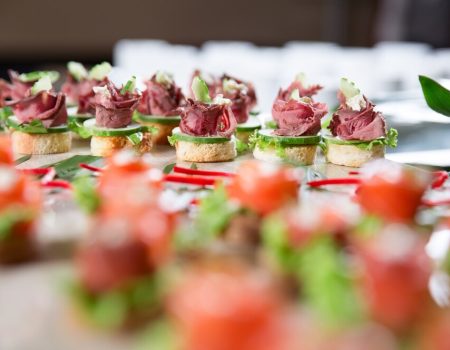 canapes-with-meat-cucumber-buffet-table_1262-1717